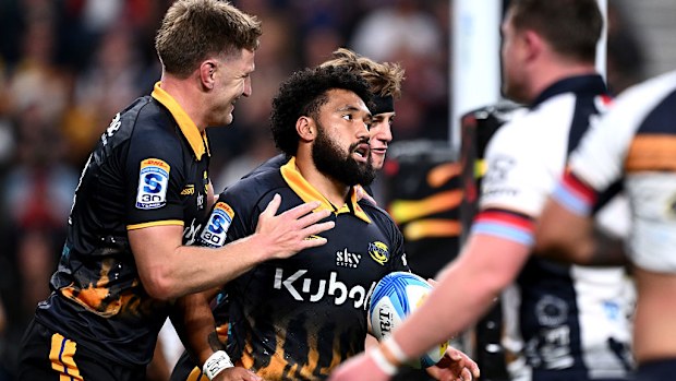 Fehi Fineanganofo of the Hurricanes celebrates after scoring a try.