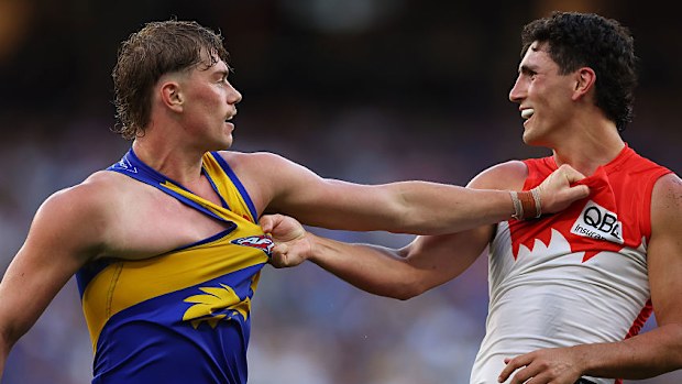 Harley Reid and Justin McInerney wrestle.