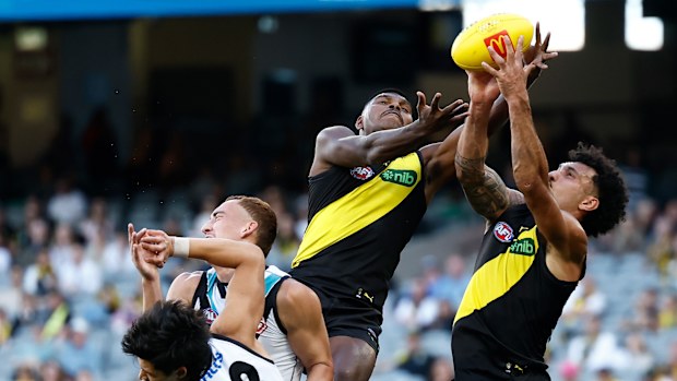 MELBOURNE, AUSTRALIA - APRIL 04: Maurice Rioli of the Tigers takes a spectacular mark over Logan Evans of the Power during the 2026 AFL Round 04 match between the Richmond Tigers and the Port Adelaide Power at the Melbourne Cricket Ground on April 4, 2026 in Melbourne, Australia. (Photo by Michael Willson/AFL Photos via Getty Images)
