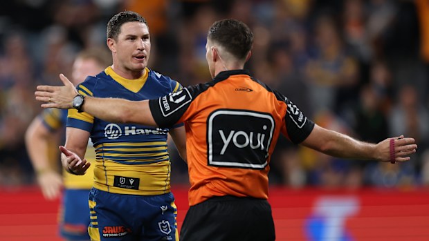 Mitchell Moses of the Eels questions referee Peter Gough.