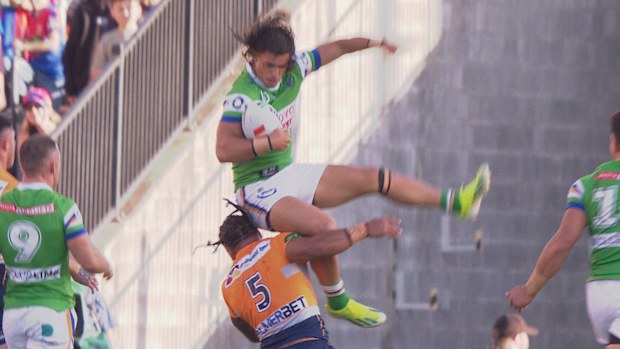 Kaeo Weekes is collected in the air by Greg Marzhew.