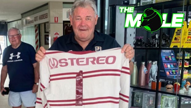 Manly legend Graham Eadie holds up his 1978 grand final jersey.