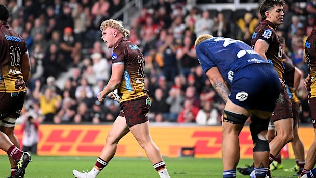 Louis Werchon of the Reds celebrates after scoring a try.