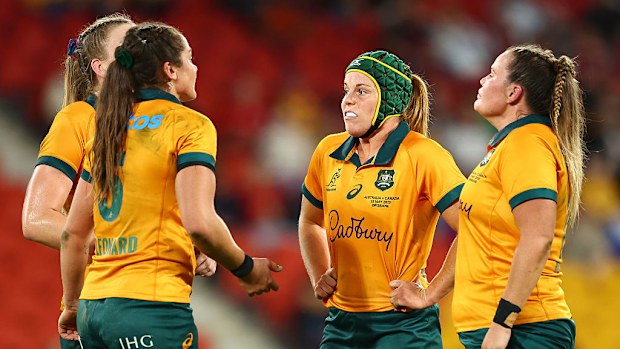 Emily Chancellor of the Wallaroos reacts alongside teammates.