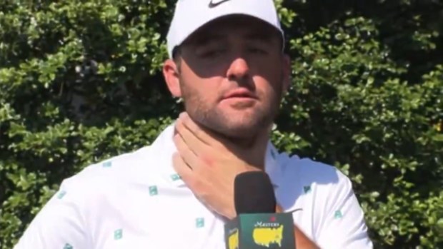 Scottie Scheffler talks to the press pack.